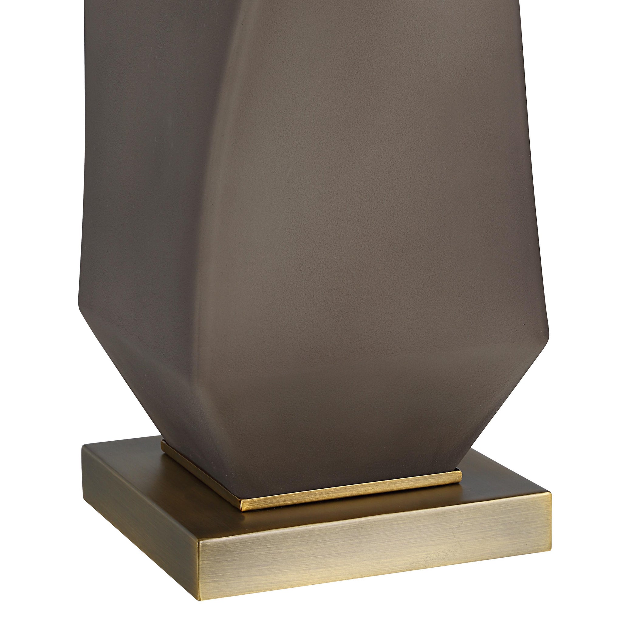 Close-up of Mallorca table lamp's gray base and gold square pedestal