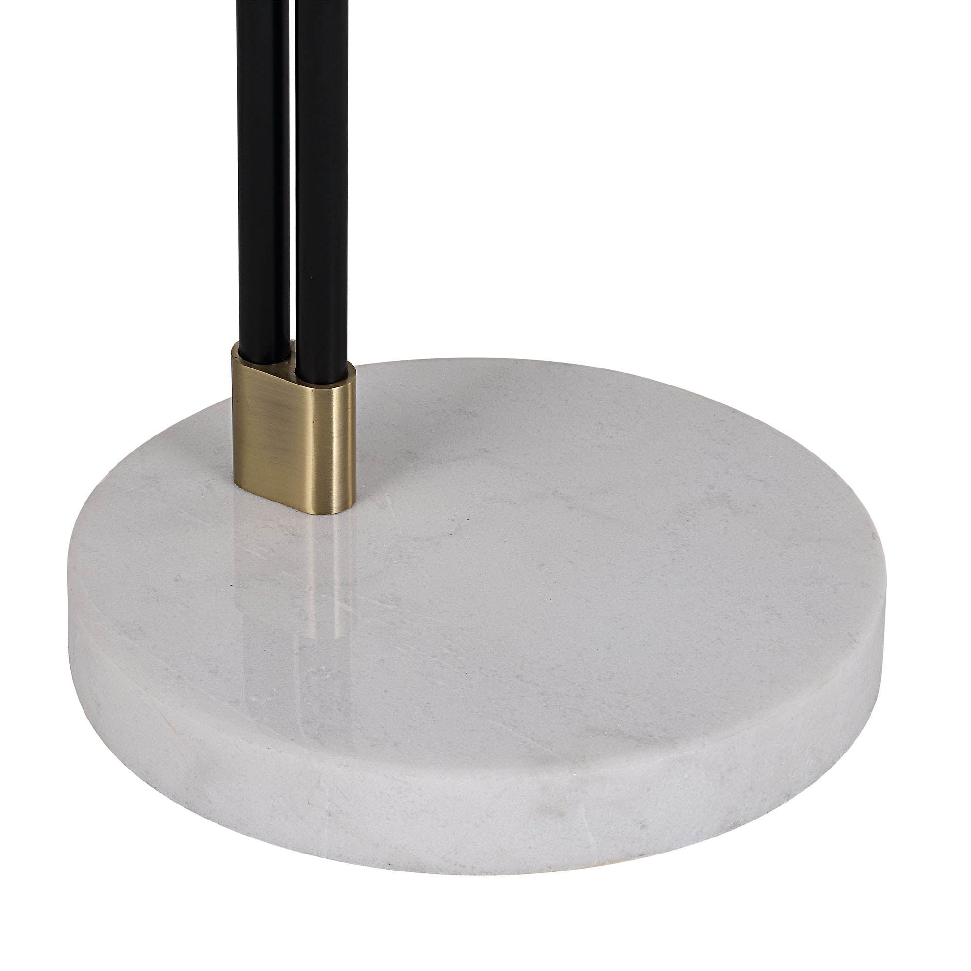 Close-up of Wroxton Floor Lamp's marble base with black metal support and brass accents.