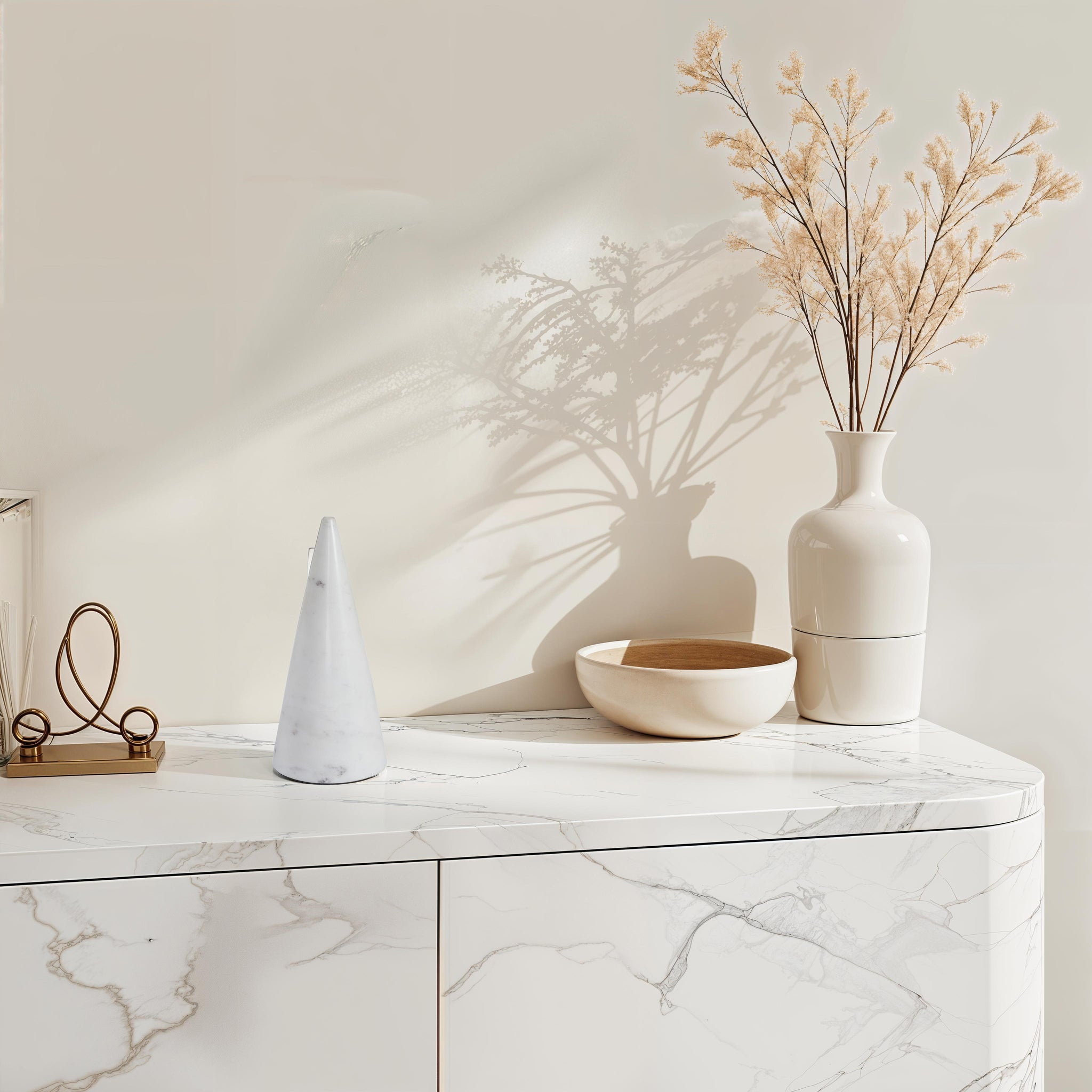 Silica statue by Renwil on a marble surface with decorative items and dried flowers.
