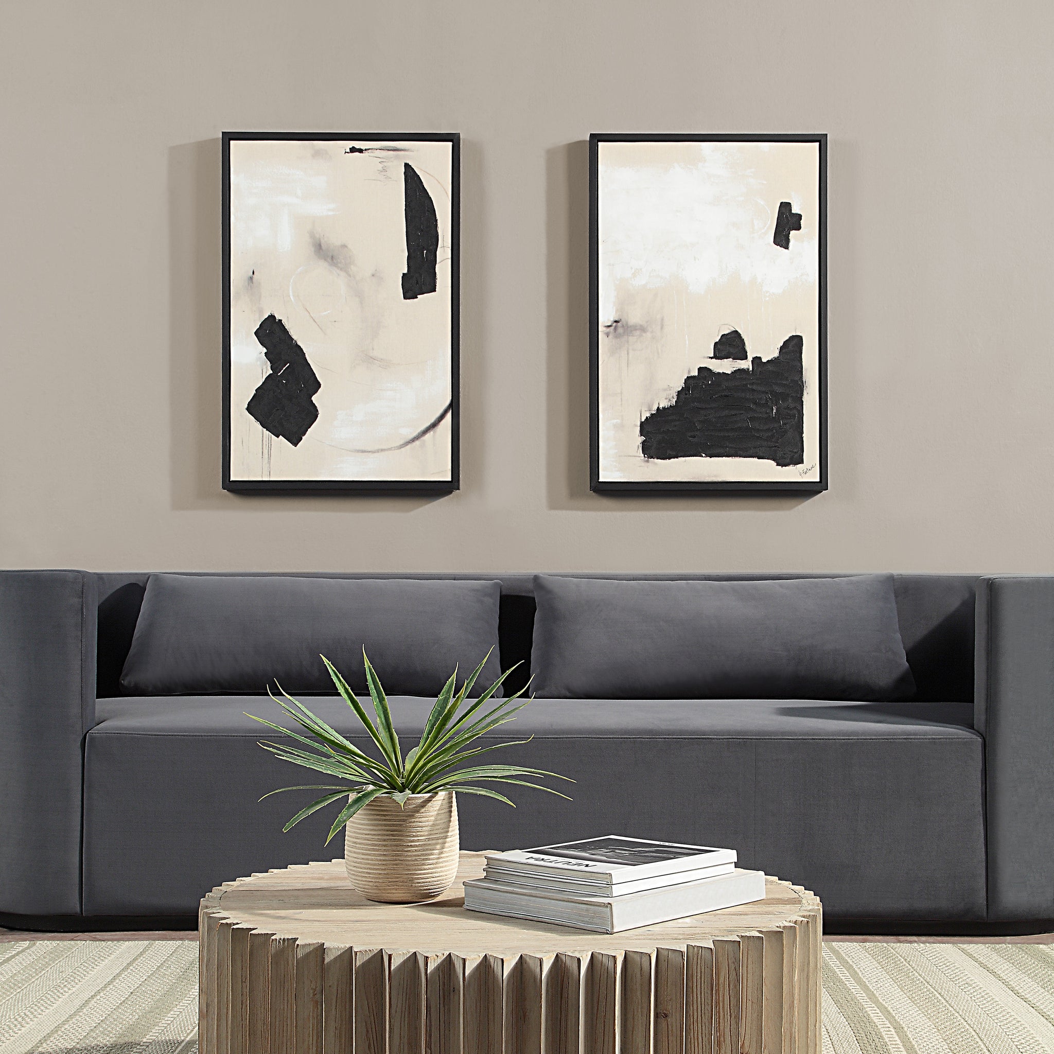 Asia Canvas Art displayed above a modern gray sofa with a plant and coffee table.