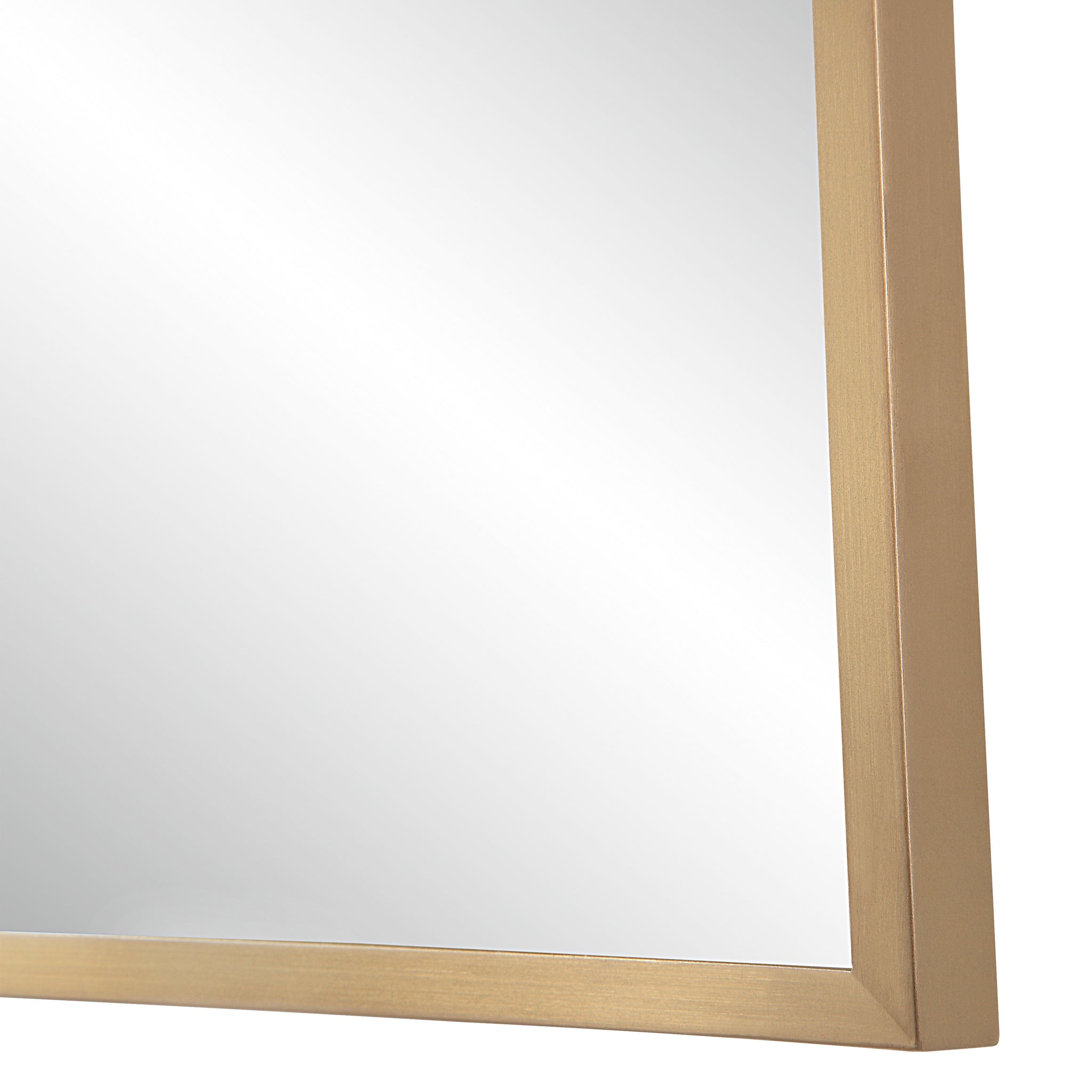 Close-up of the gold metal frame of the Ariadne Wall Mirror.