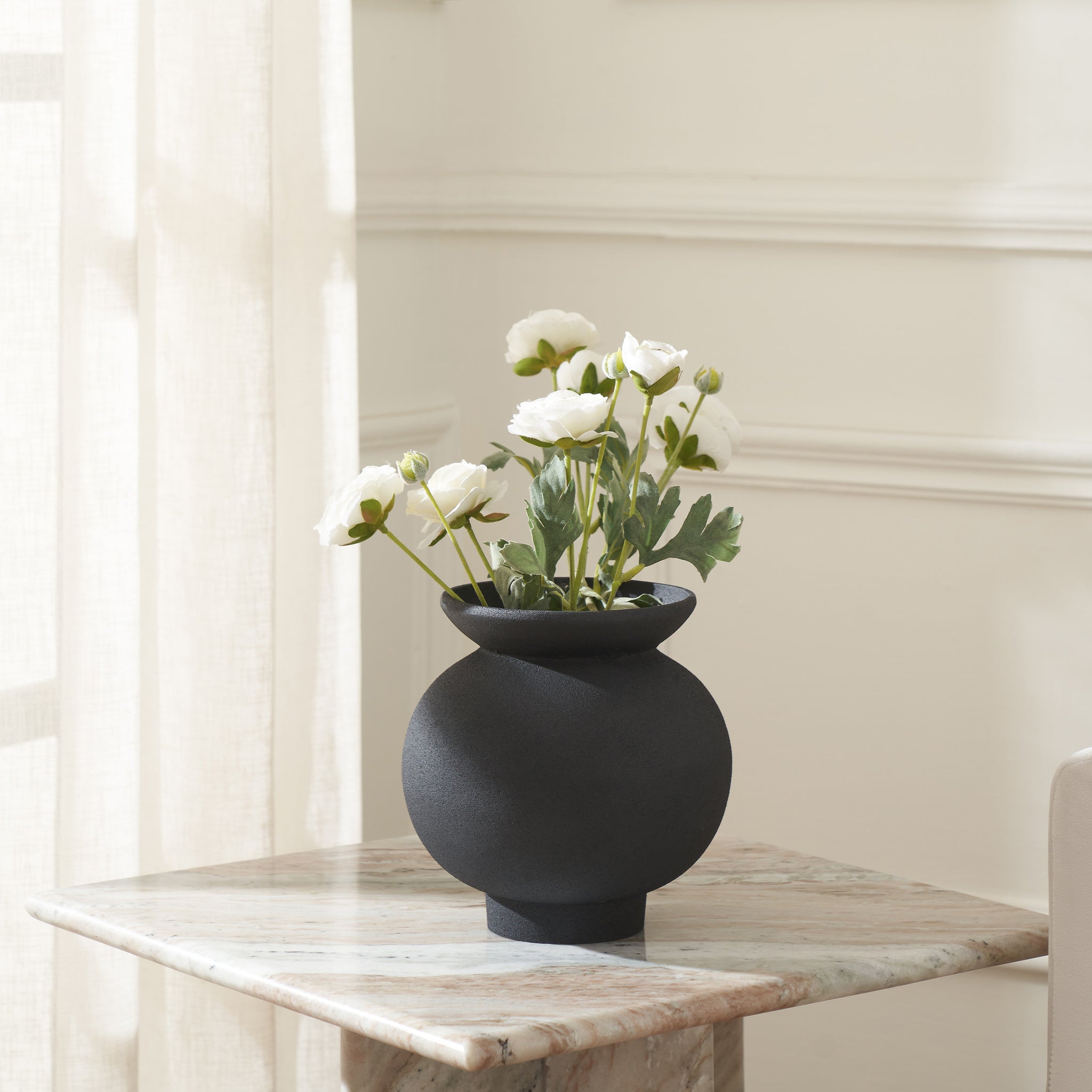 Cadiz vase by Renwil, close-up of the black ceramic vase's rim and textured surface.
