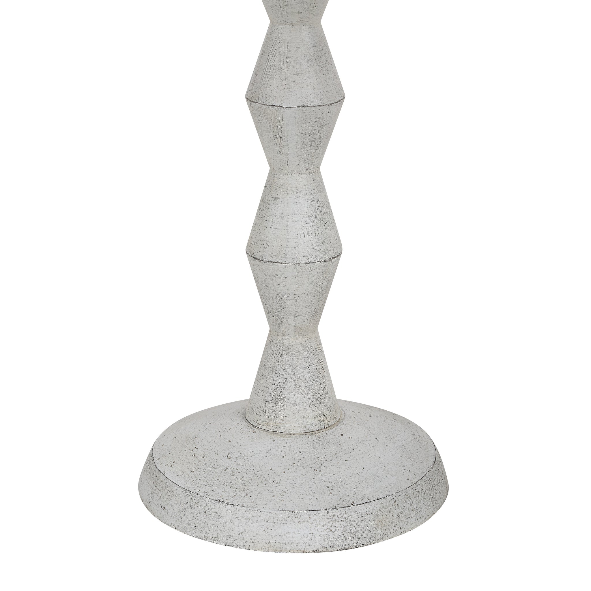 Close-up of Sorriso floor lamp's light gray geometric base and texture.