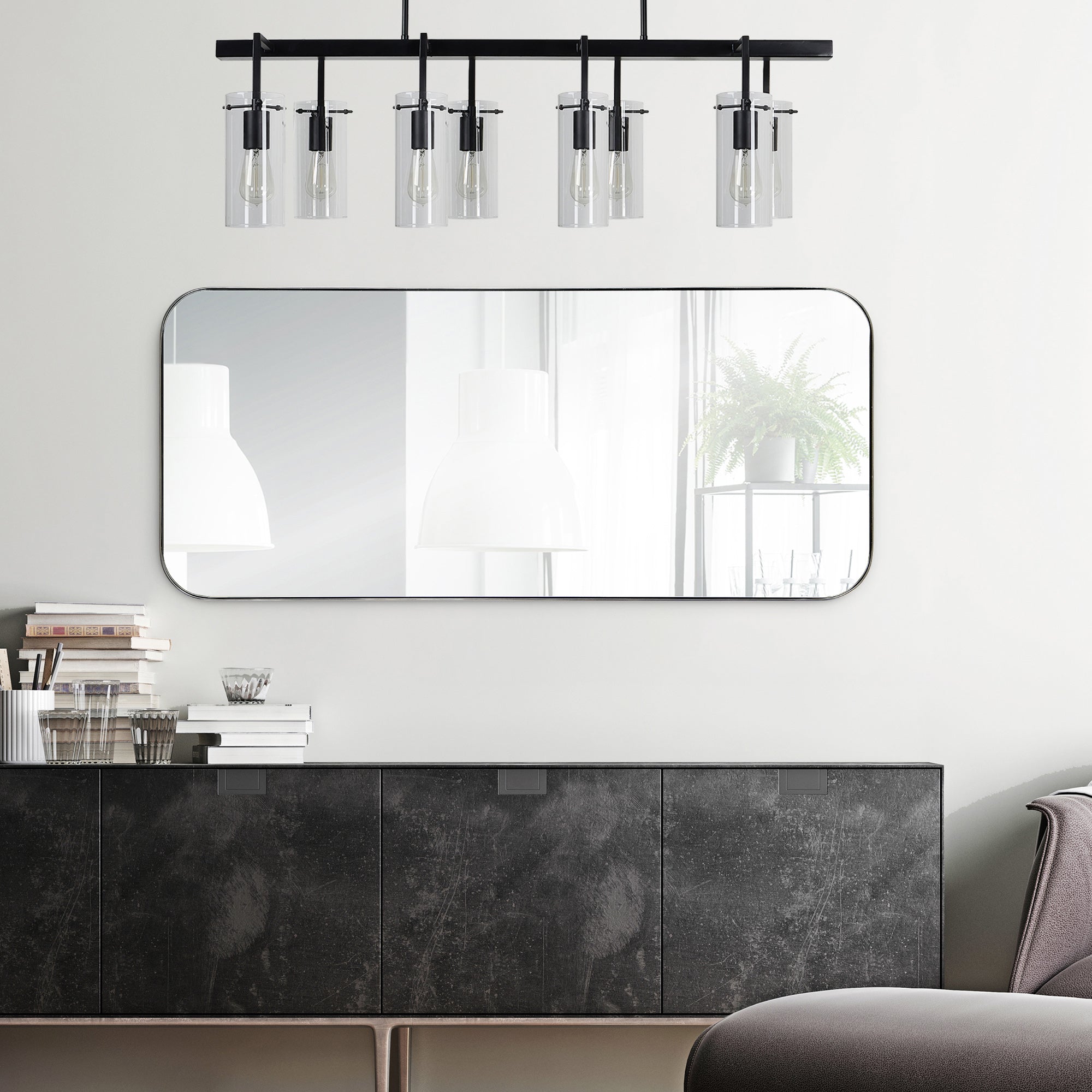 Delphinus Wall Mirror mounted above a dark cabinet, featuring a rectangular shape and modern lighting.