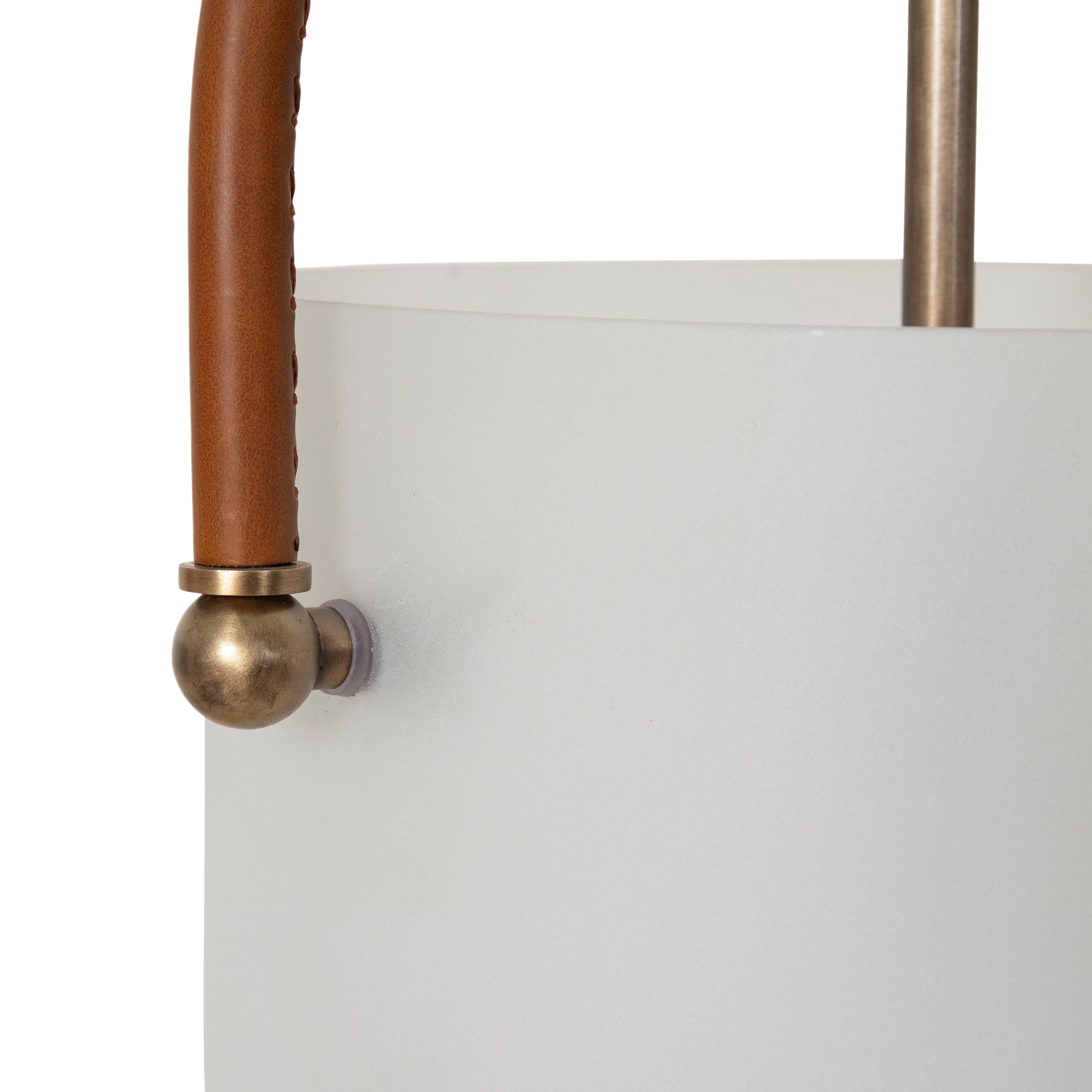 Close-up of Brillio pendant light showing frosted glass shade and leather handle detail.