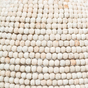 Profile view of the Theta White-Washed Wood Beaded Pendant Light.