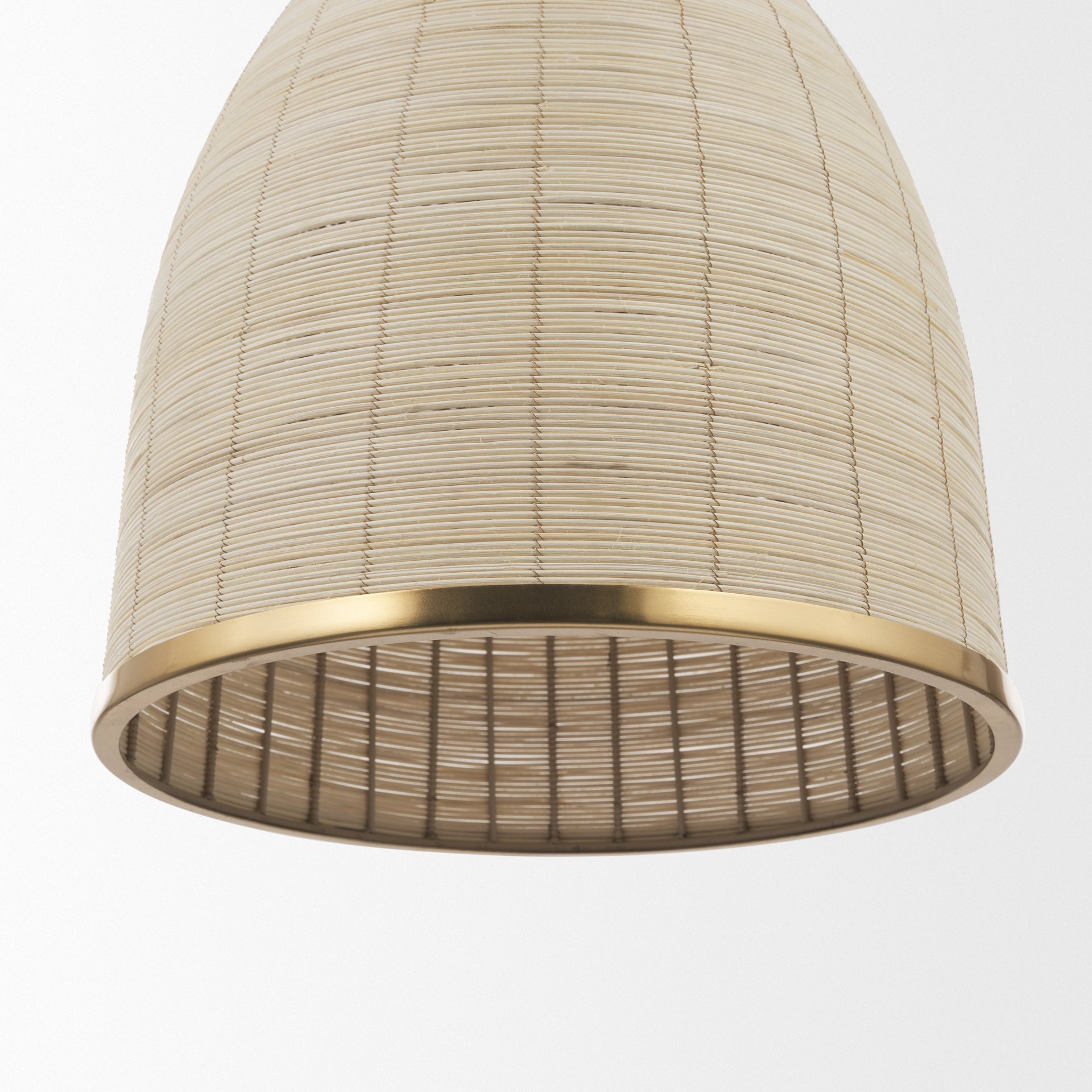 Saliha Cane w/ Brass Metal Pendant Light shown from a different angle to reveal its silhouette.