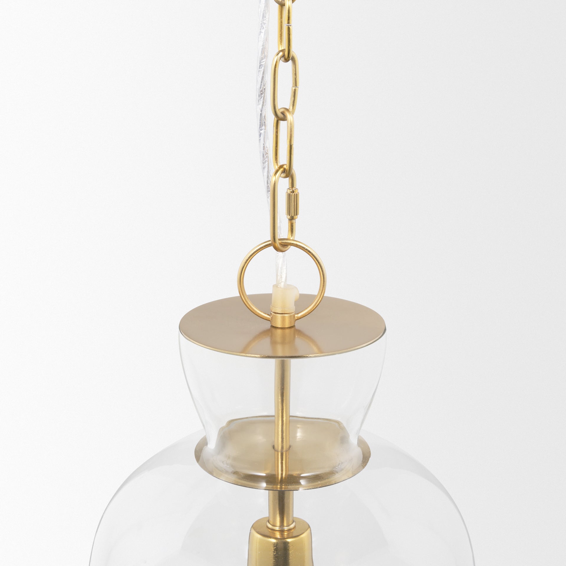 Sadah Tall Clear Blown Glass w/ Gold Metal Pendant Light viewed from the side.