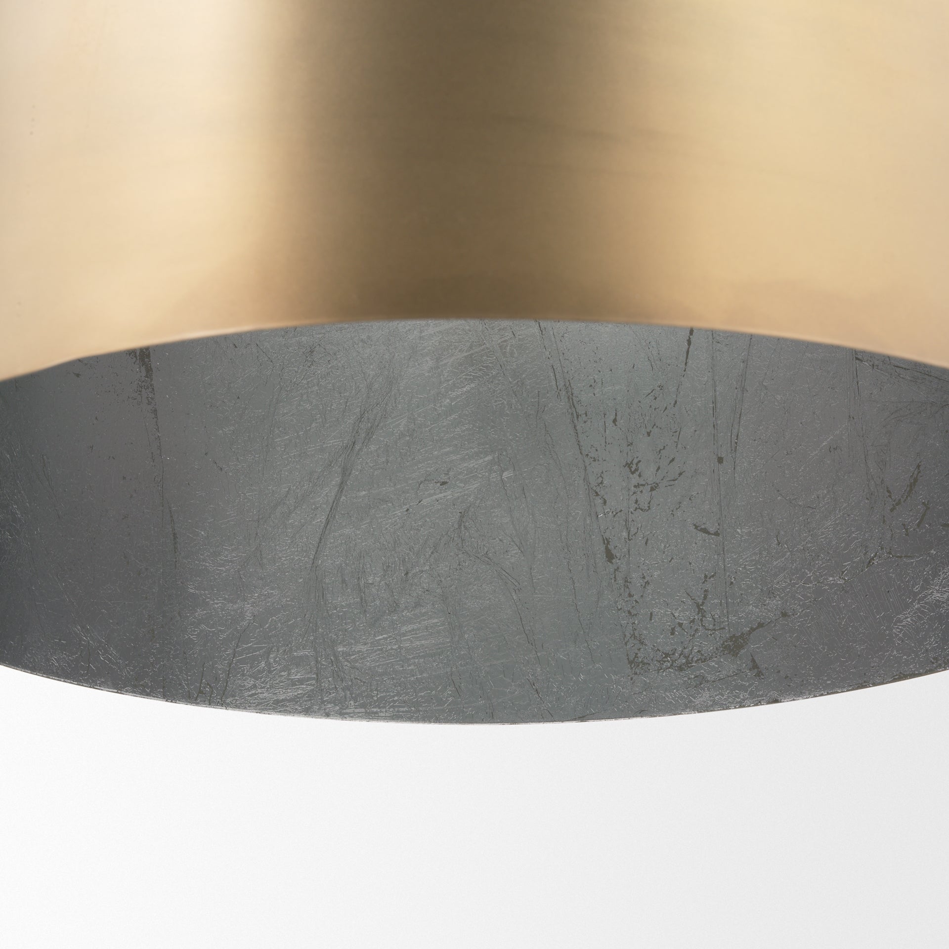 Profile view of the Sanne Antiqued Gold Metal w/ Silver Foil Large Pendant Light.