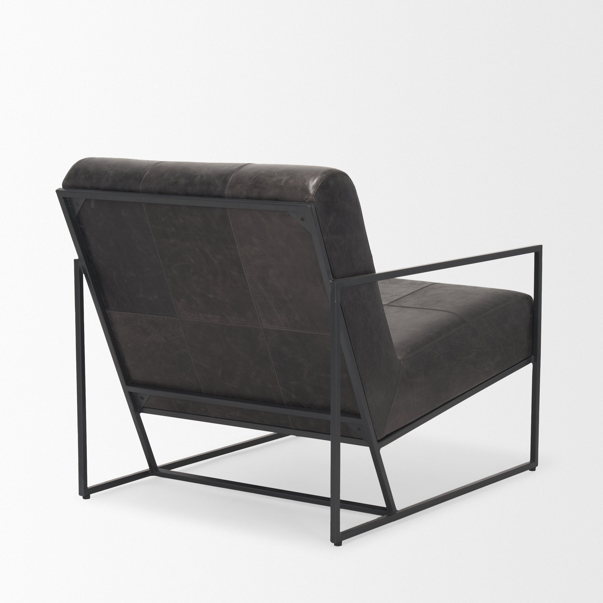 Stratton Gunmetal w/ Genuine Aged Black Leather Upholstered Accent Chair viewed from the side.