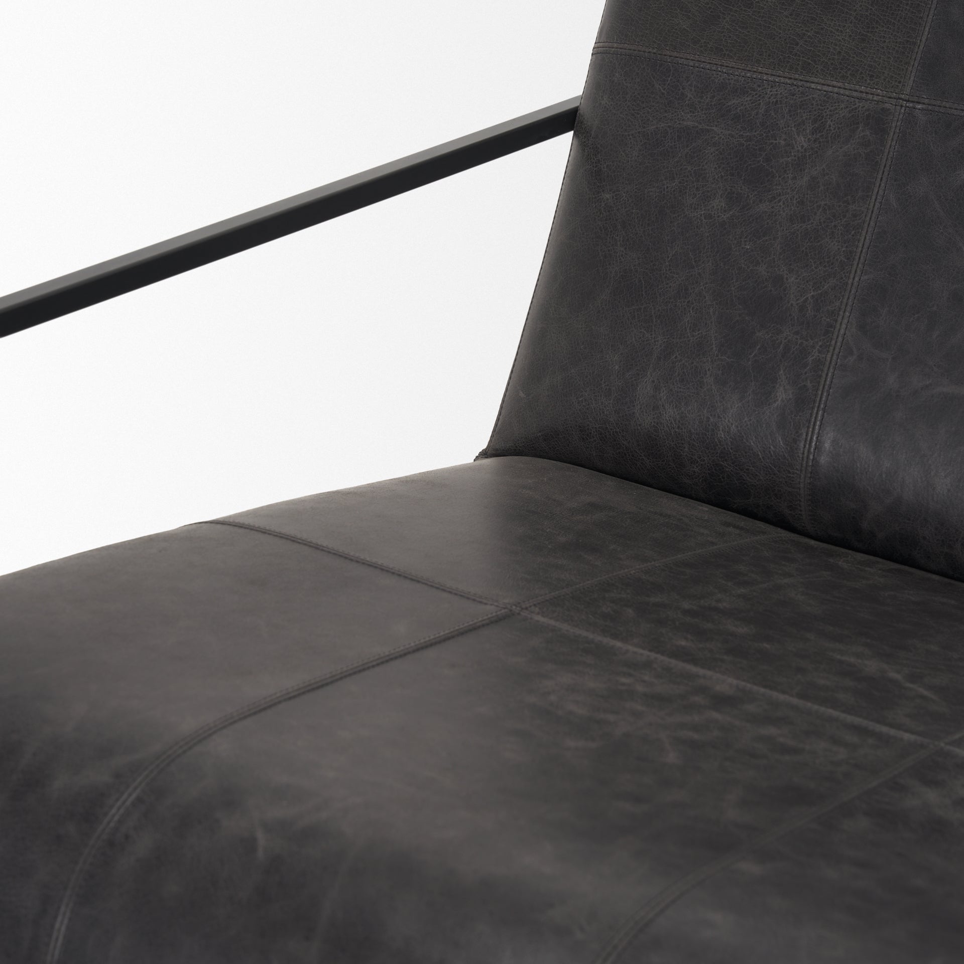 Profile view of the Stratton Gunmetal w/ Genuine Aged Black Leather Upholstered Accent Chair.