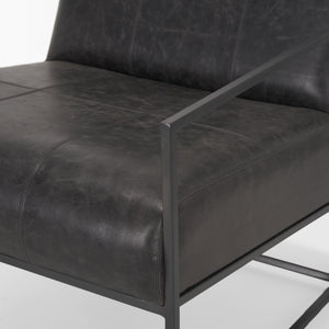 Stratton Gunmetal w/ Genuine Aged Black Leather Upholstered Accent Chair viewed from the side.