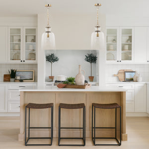 Profile view of the Sadah Tall Clear Blown Glass w/ Gold Metal Pendant Light.