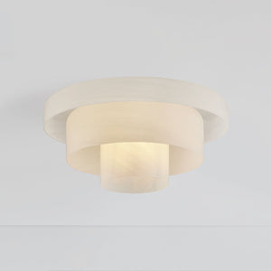 Port Richmond Flush Mount in aged brass shown from the front to reveal the shade profile and mounting canopy.