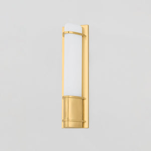 Tottenville Wall Sconce 4.25" x 16.25" in aged brass shown from the front to reveal the arm curve and shade silhouette.