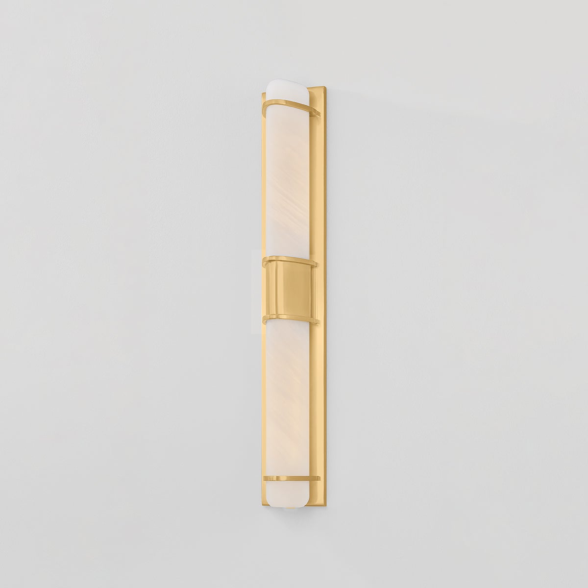 Close-up of the Tottenville Wall Sconce 4.25" x 27" in aged brass showing the arm curve and shade silhouette.