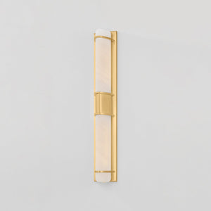 Close-up of the Tottenville Wall Sconce 4.25" x 27" in aged brass showing the arm curve and shade silhouette.