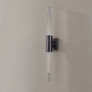 Close-up of the Asher Wall Sconce 4.25" in bronze showing the arm curve and shade silhouette.