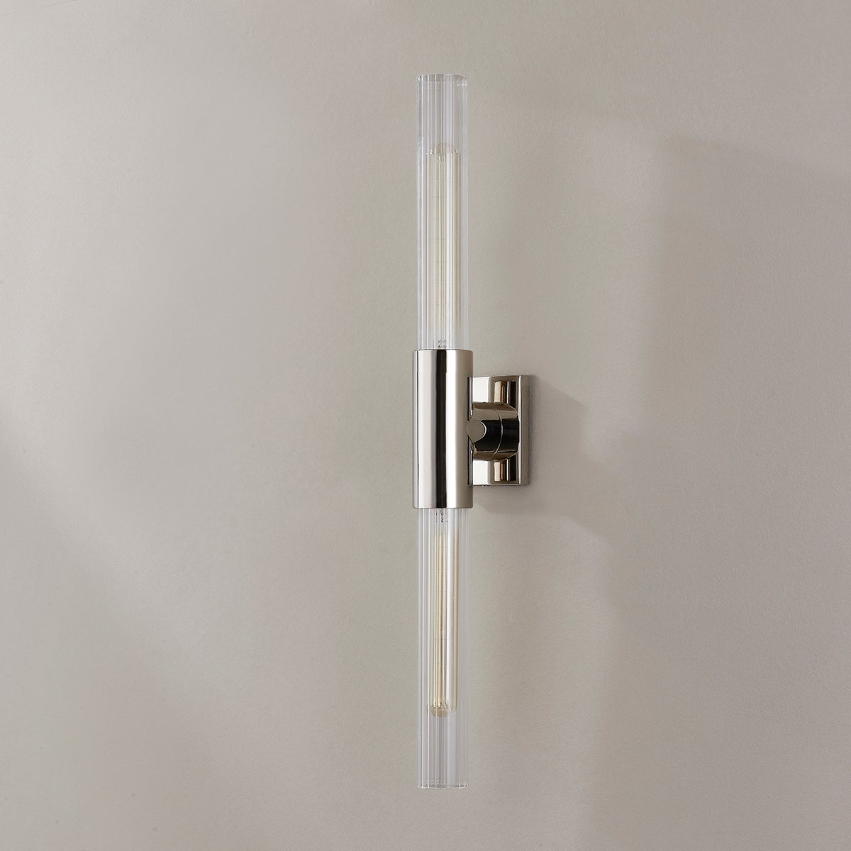 Close-up of the Asher Wall Sconce 4.25" in polished nickel showing the arm curve and shade silhouette.
