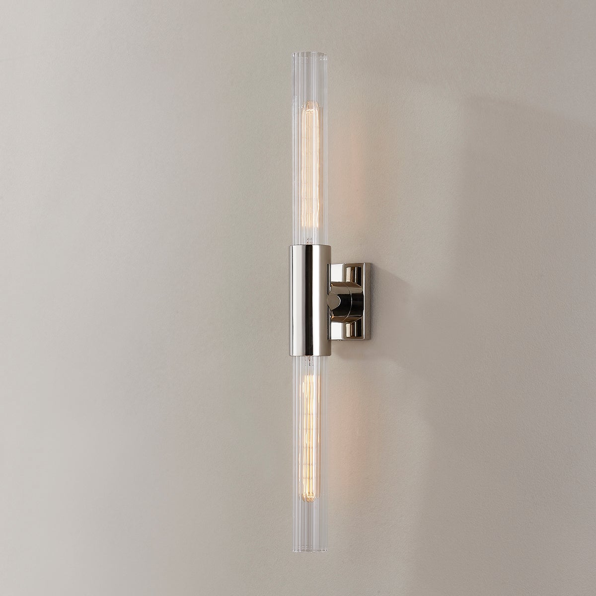 Close-up of the Asher Wall Sconce 4.25" in polished nickel showing the arm curve and shade silhouette.