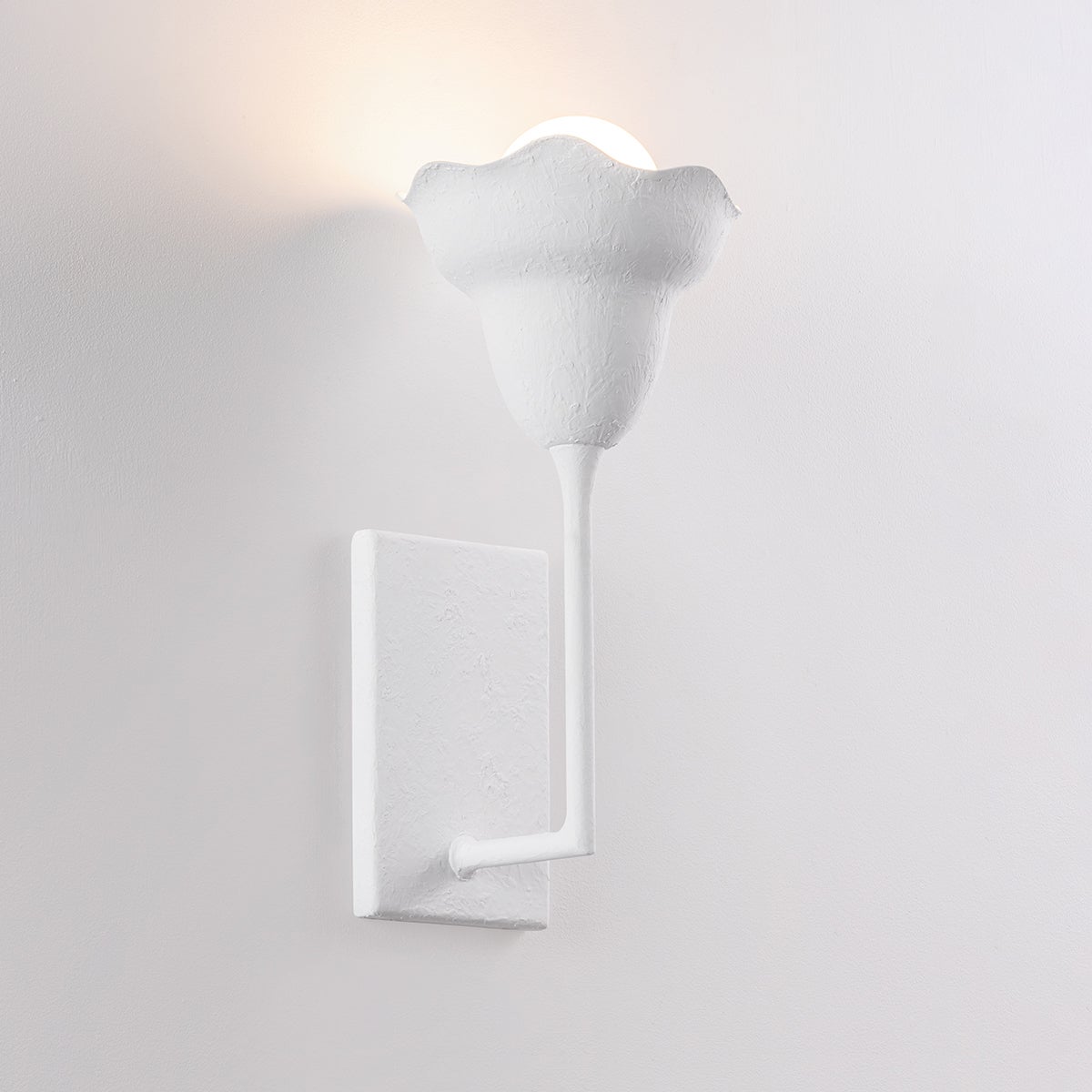 Alora Wall Sconce shown from the front to reveal the arm curve and shade silhouette.