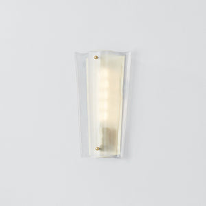Close-up of the Baxford Wall Sconce in aged brass showing the arm curve and shade silhouette.