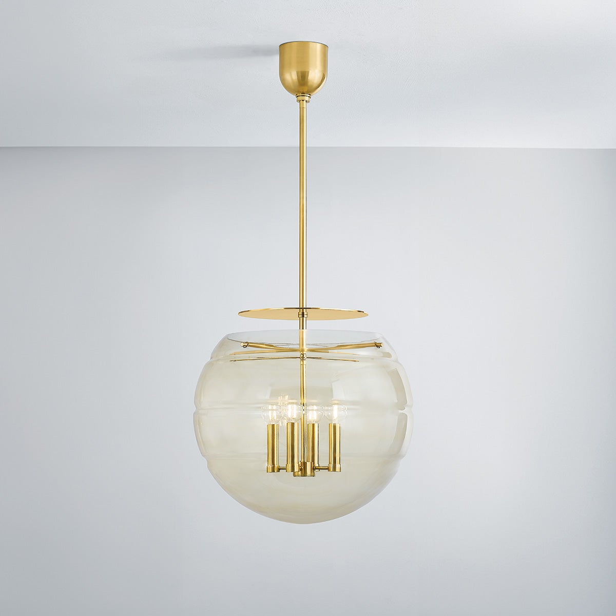 Gill Pendant 19.5" in aged brass shown from the front to reveal the shade shape and metal detail.
