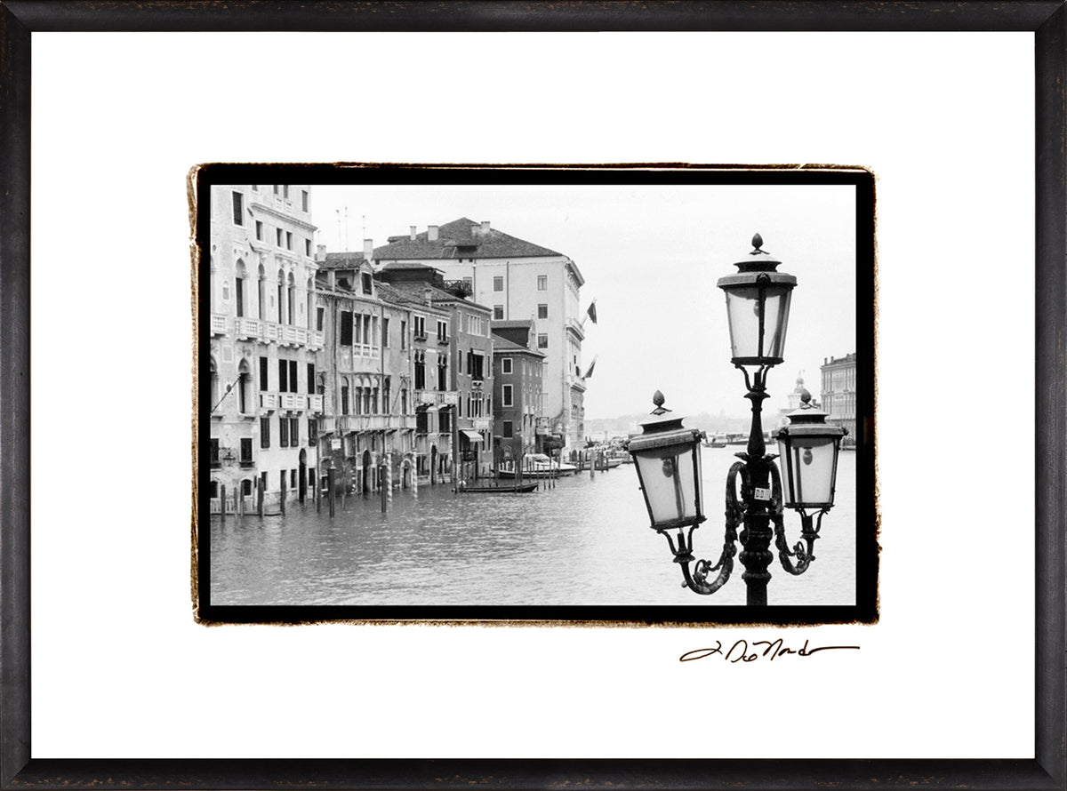 Waterways Of Venice XI wall art featuring a black and white photo of Venetian buildings and street lamps.