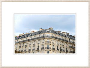 Parisian Apartment Block wall art featuring a classic Parisian building with ornate balconies and gray rooftops.