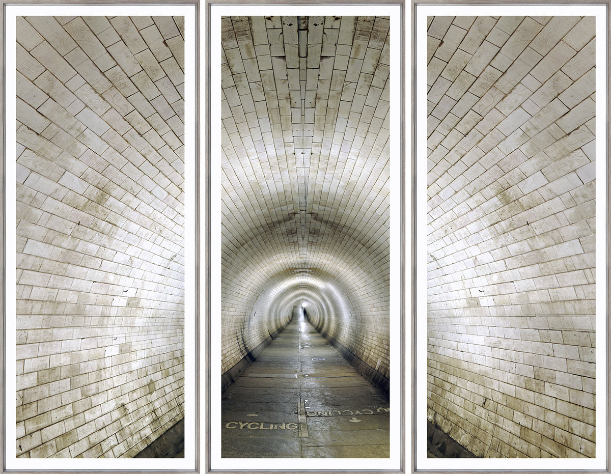 Cycling Tunnel Triptych wall art featuring a tunnel with white tiled walls and a smooth pathway
