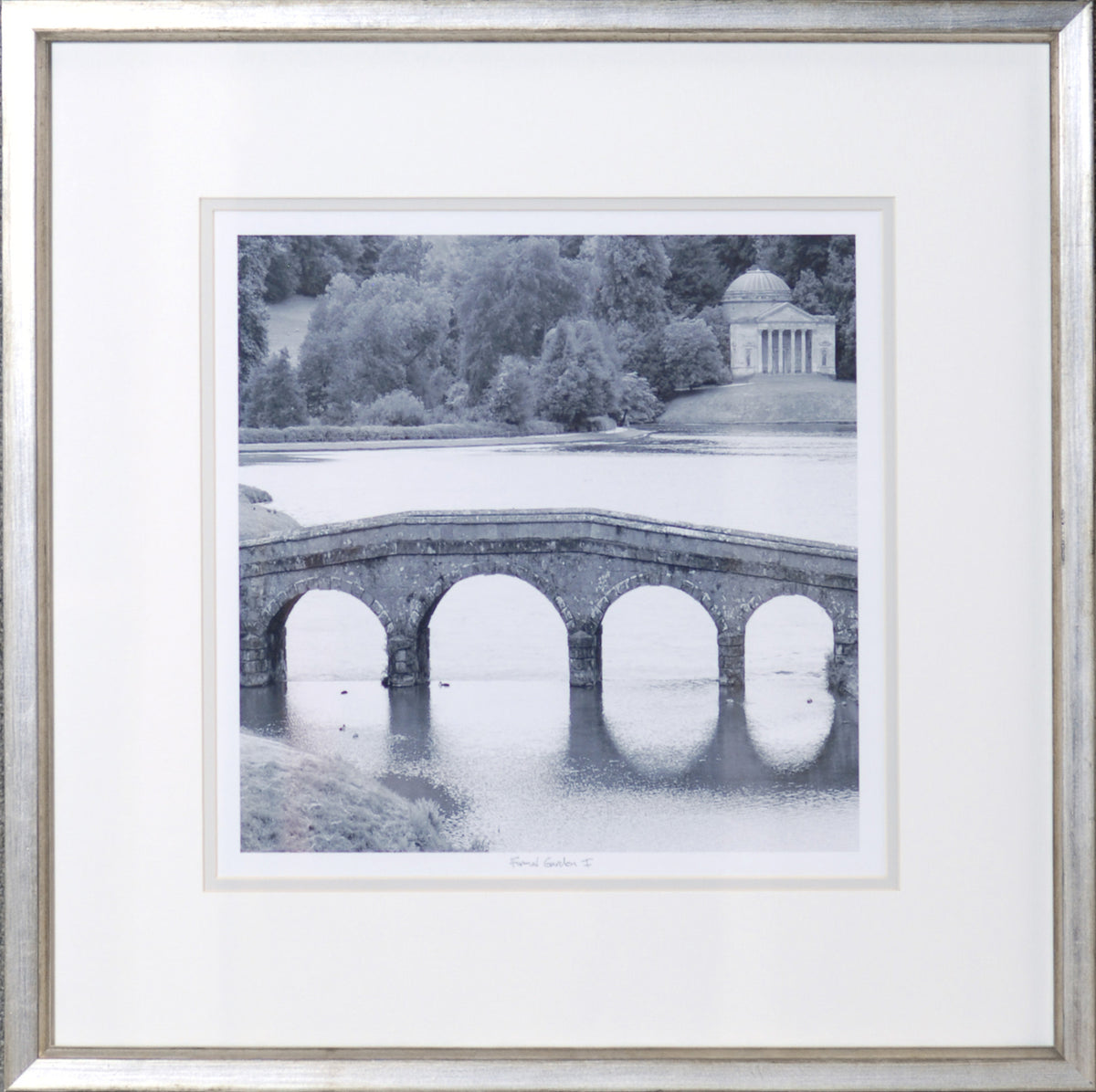 Formal Garden I wall art featuring a black and white image of a stone bridge over water.