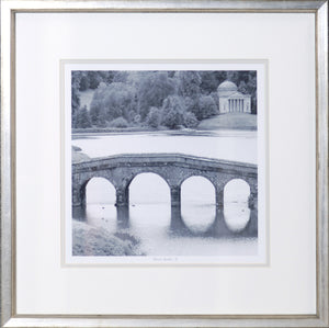 Formal Garden I wall art featuring a black and white image of a stone bridge over water.