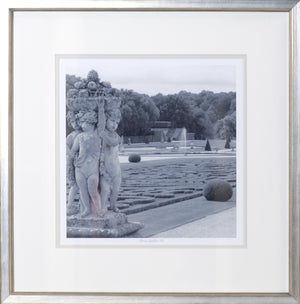 Formal Garden VI wall art featuring a black and white image of cherubs and a garden landscape.