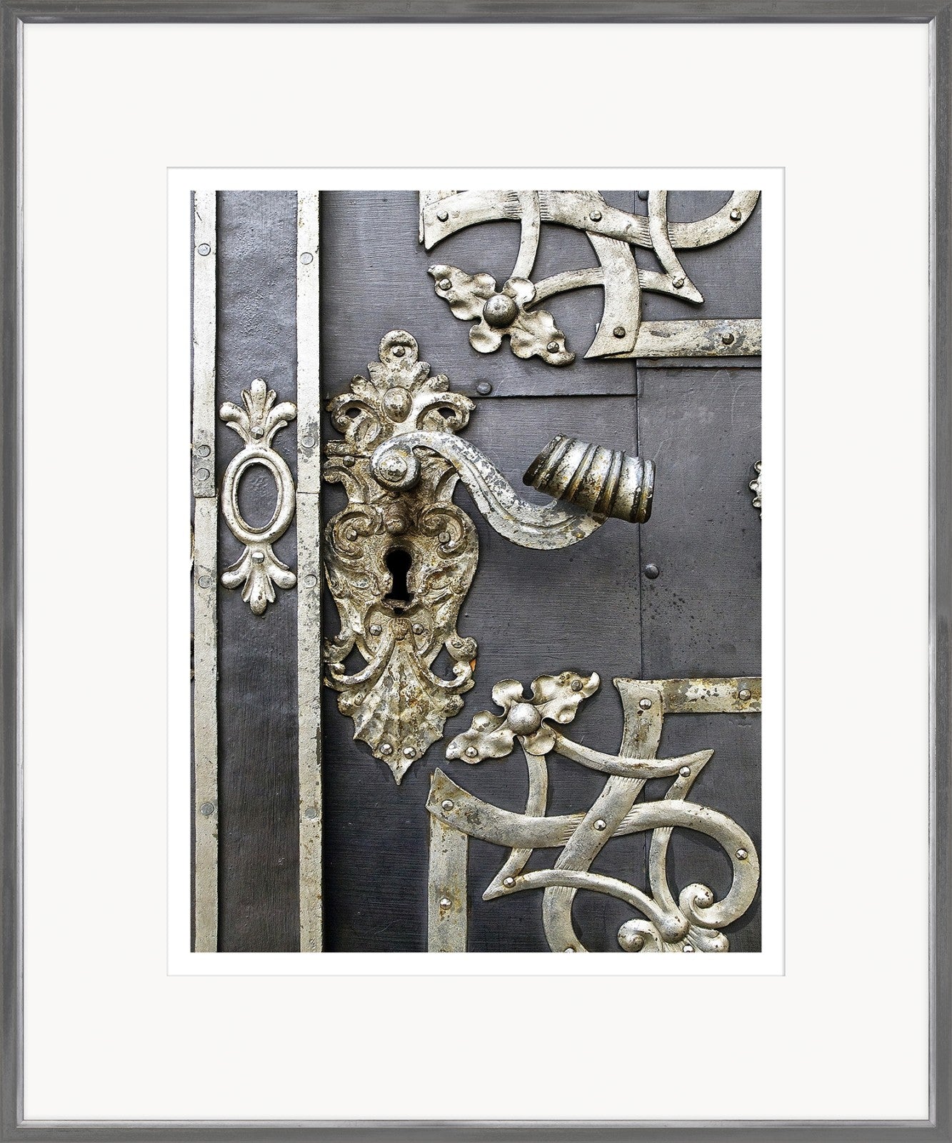 European Door Detail I wall art featuring ornate metal door handle and keyhole on a dark background.