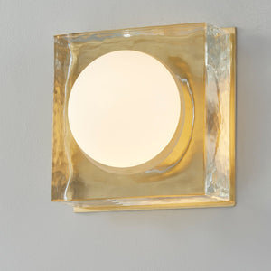 Close-up of the Mackay Wall Sconce 7.75" x 7.75" in aged brass showing the arm curve and shade silhouette.