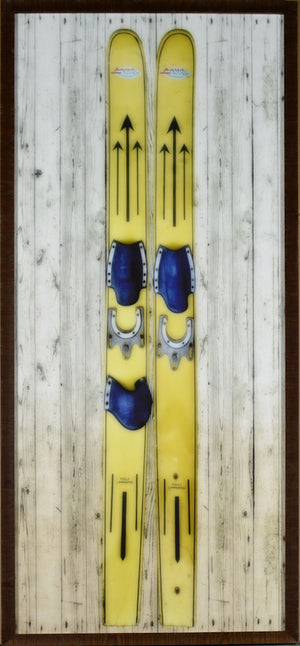 Vintage Water Skis wall art featuring yellow skis with blue bindings on a wood background.
