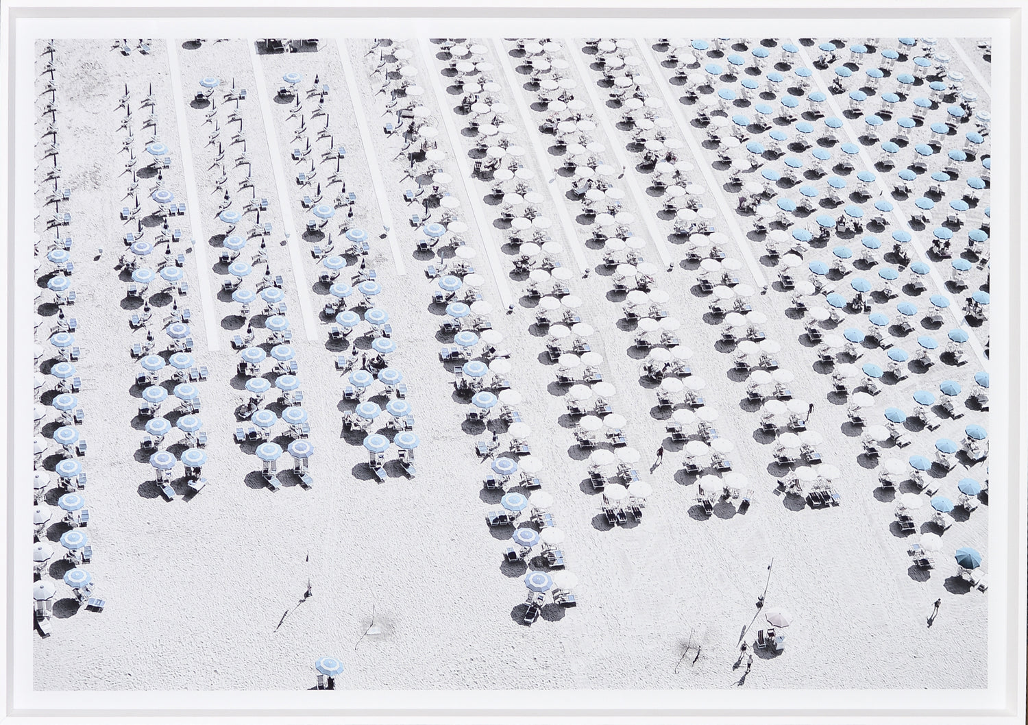 Aerial Beach View #1 wall art featuring rows of blue and white umbrellas on a sandy beach.