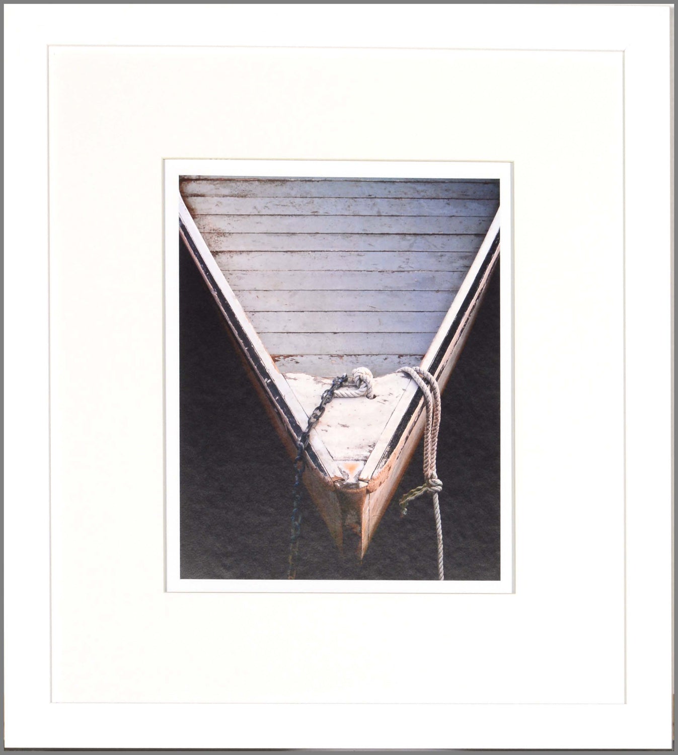 Wooden Rowboats II wall art featuring the bow of a wooden boat with rope, in earthy tones.