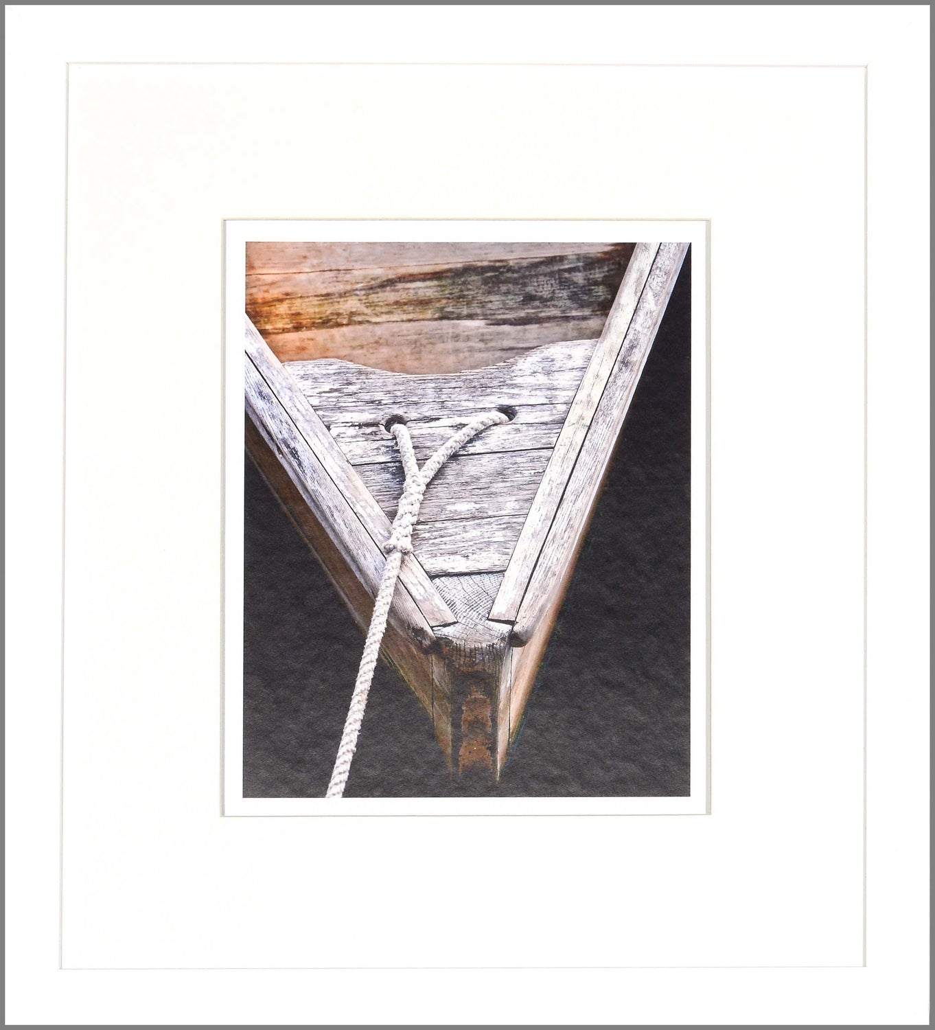 Wooden Rowboats III wall art featuring a close-up of a weathered boat's bow with rope.