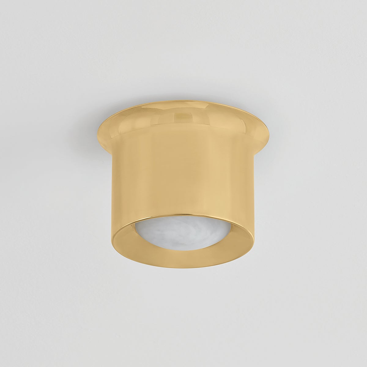 Noxon Flush Mount 7" in aged brass shown from the front to reveal the shade profile and mounting canopy.