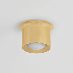 Noxon Flush Mount 7" in aged brass shown from the front to reveal the shade profile and mounting canopy.