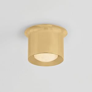 Close-up of the Noxon Flush Mount 7" in aged brass showing the shade profile and mounting canopy.