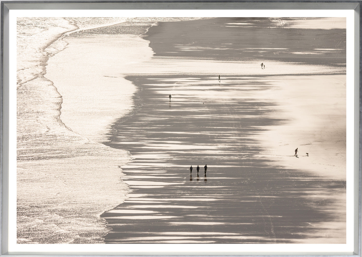 Mirrored Beach wall art featuring a serene beach scene with silhouetted figures walking on wet sand.