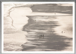 Mirrored Beach wall art featuring a serene beach scene with silhouetted figures walking on wet sand.