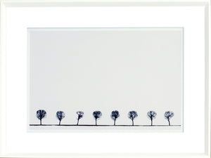 Indigo Landscape Series V wall art featuring a row of silhouetted trees against a white background.