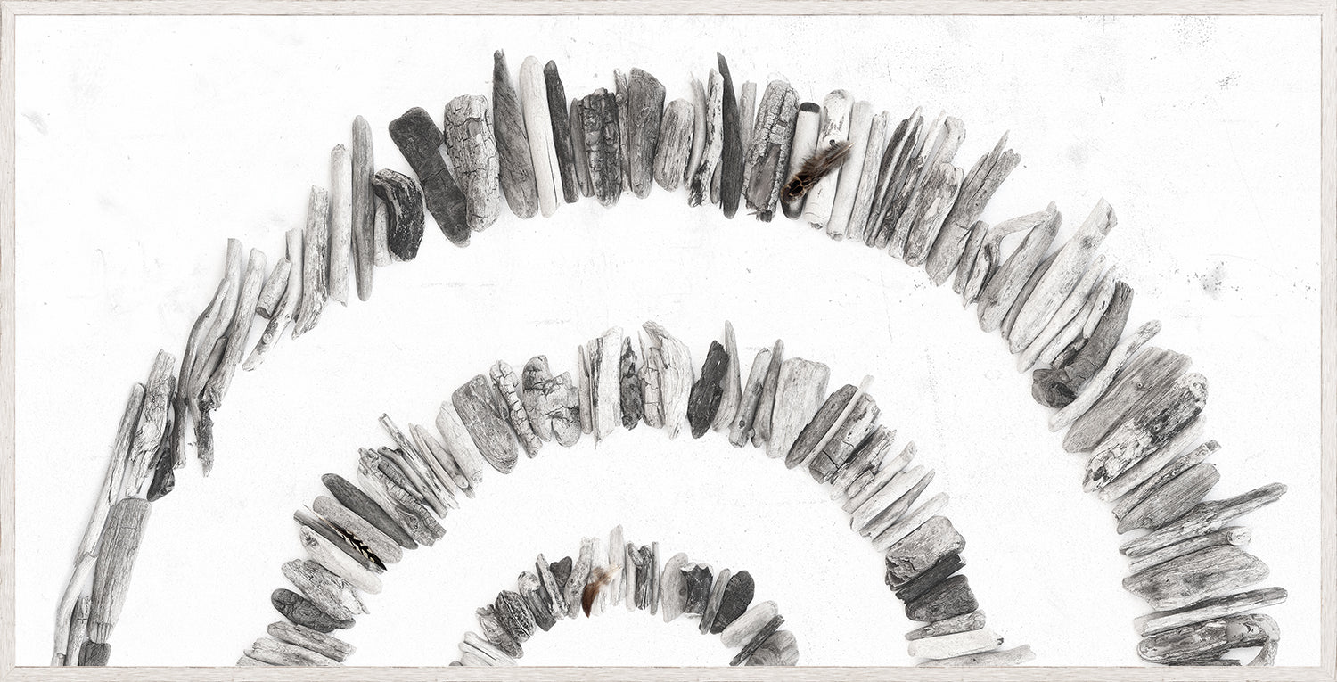 Driftwood Rainbow – Left wall art featuring a circular arrangement of gray driftwood pieces.