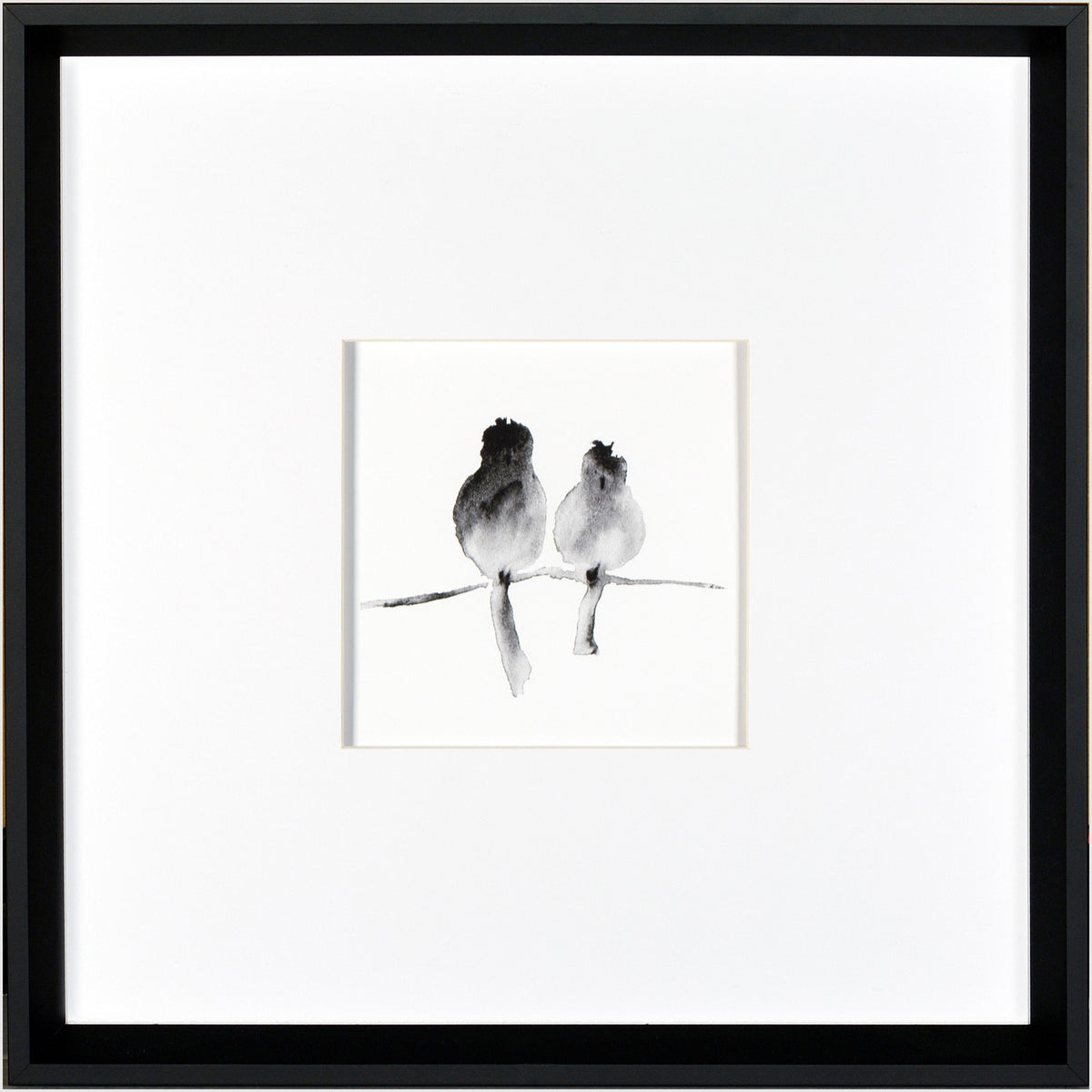 A Pair wall art featuring two birds in black watercolor on a white background, framed in black.