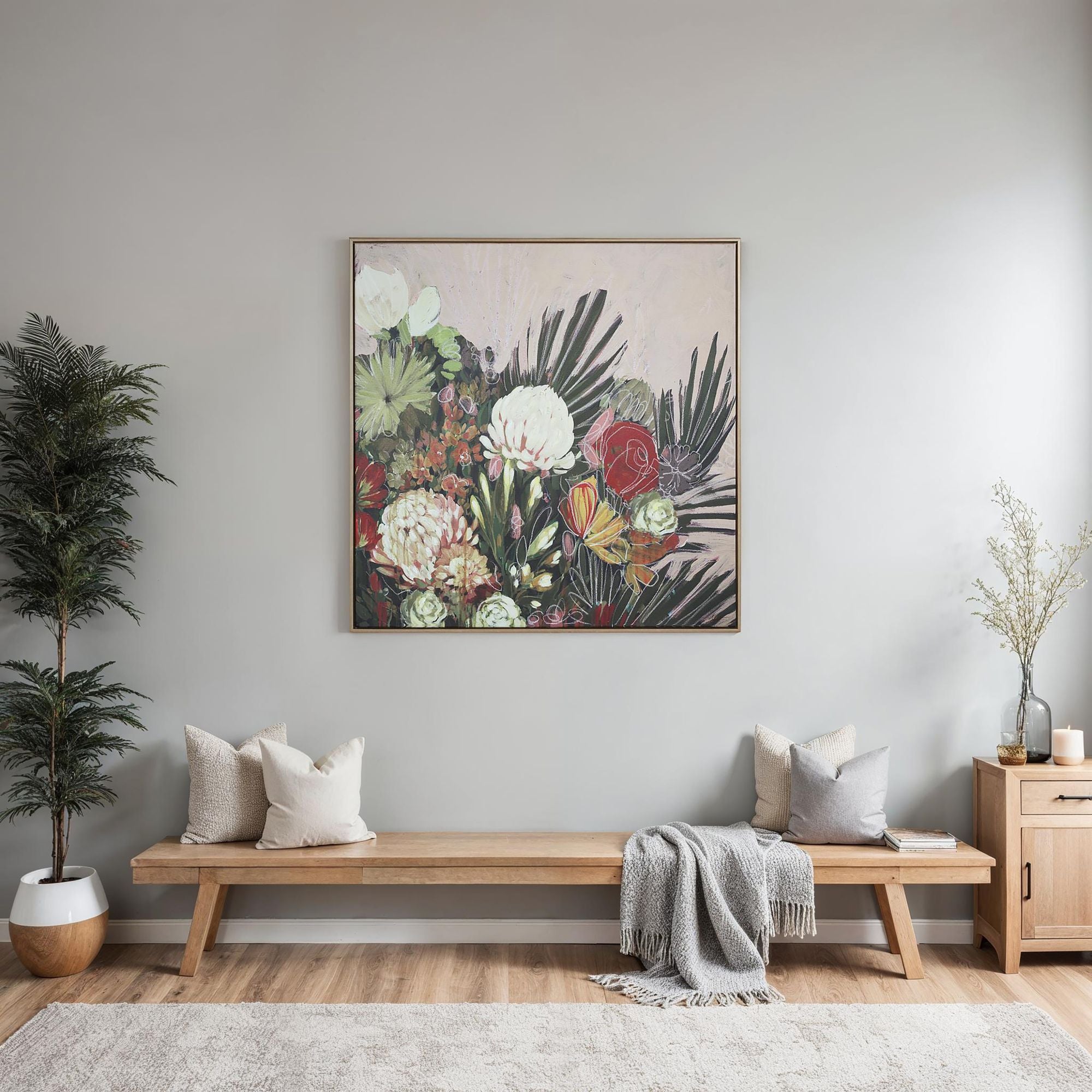 Belleza wall art featuring a vibrant floral design with red, white, and green flowers against a soft pink background.