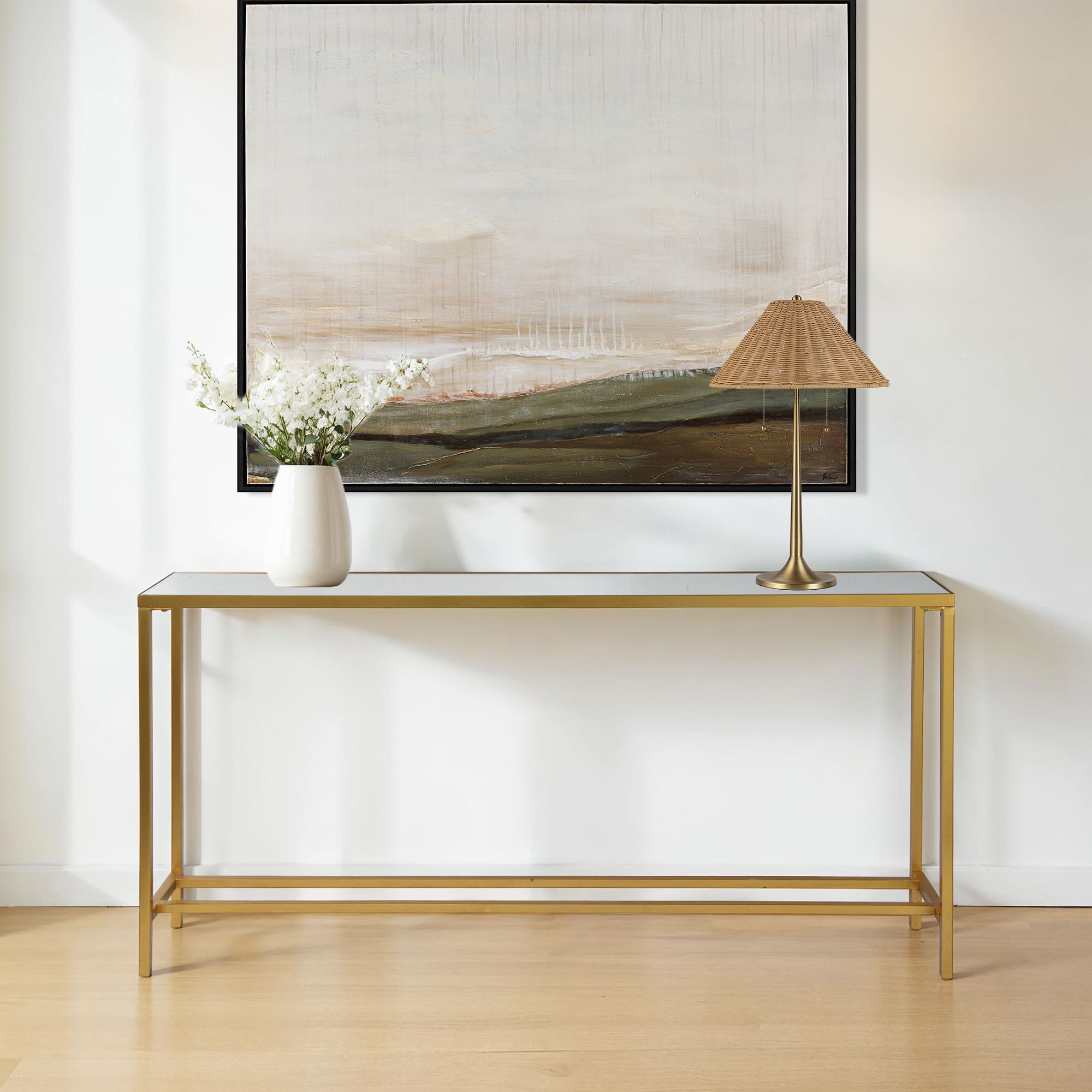 Havana console table styled with a vase and lamp against a wall art backdrop