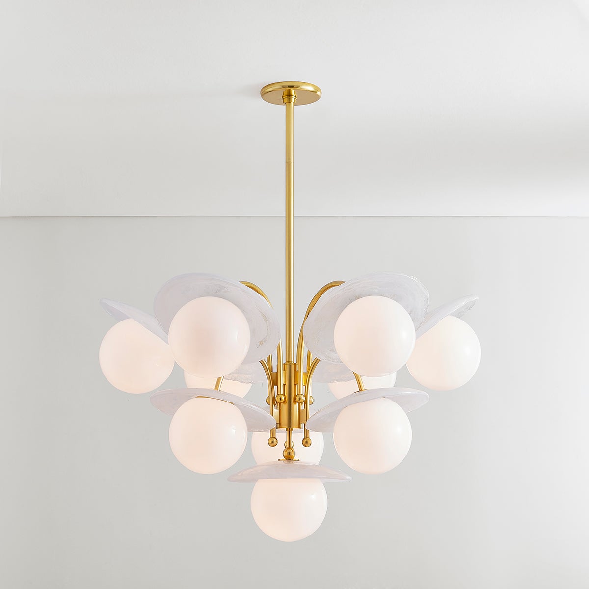 Close-up of the Stampford Chandelier in aged brass showing the frame, arms, and shade detail.